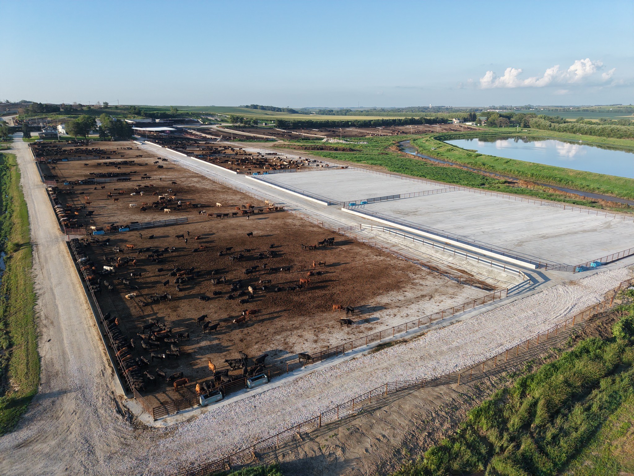 Aerial view of new concrete feedlot pens under construction.