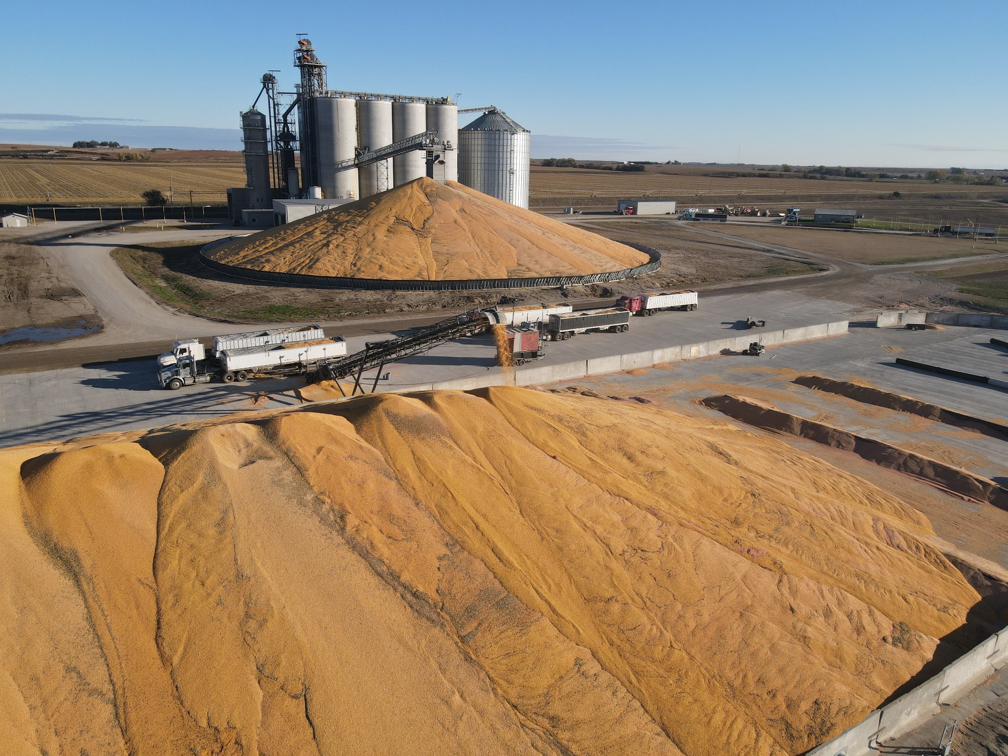 Aerial view of a long RCC grain storage pad under construction