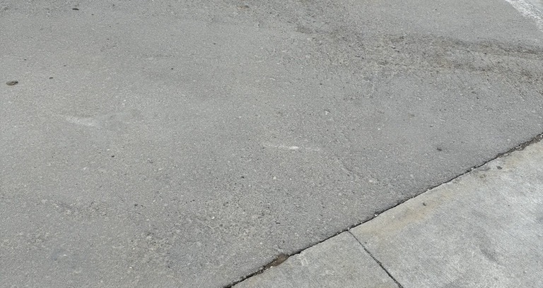 RCC above traditional concrete pavement